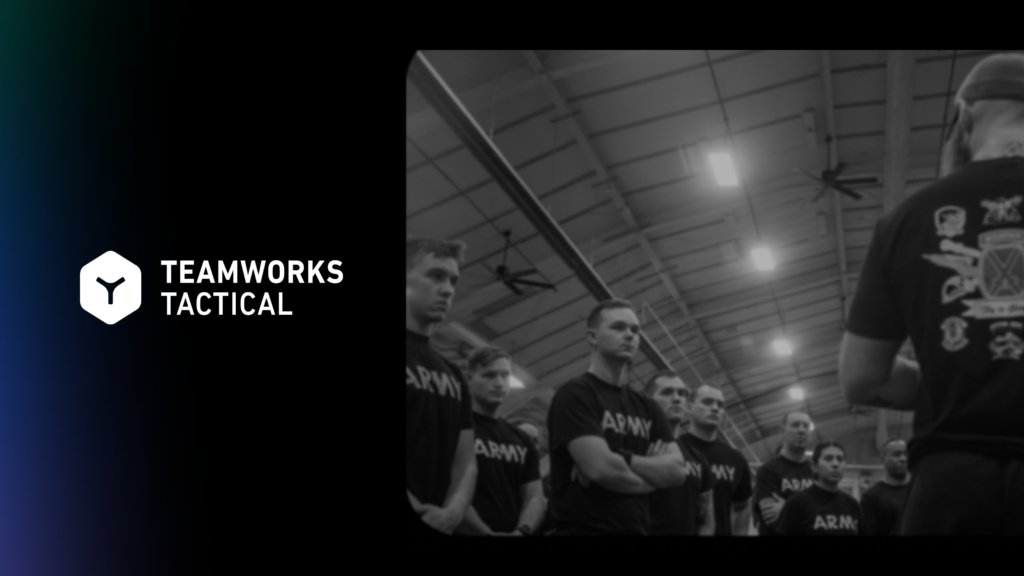 A human performance coach briefs a group of Army soldiers in training facility